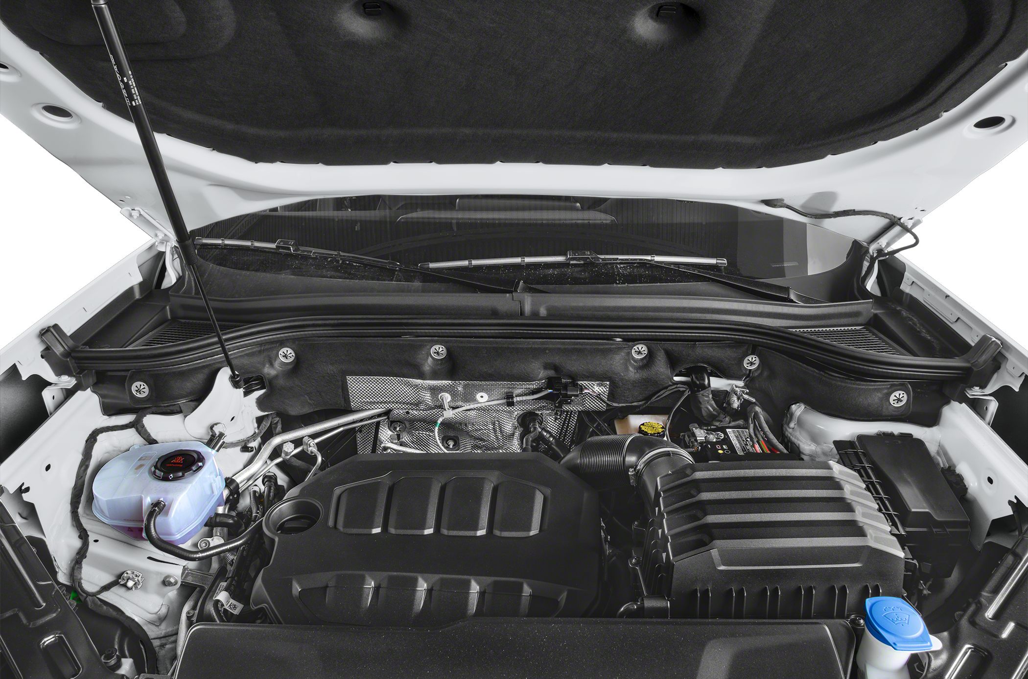 Engine bay of modern SUV showing engine cover and fluid reservoirs
