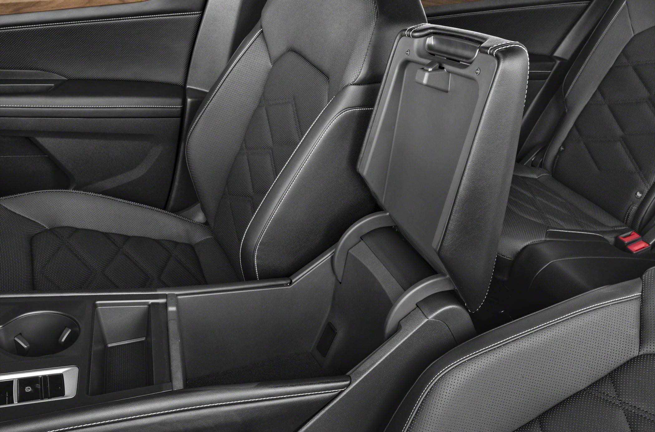 Open center console with spacious storage compartment and black perforated leather seats