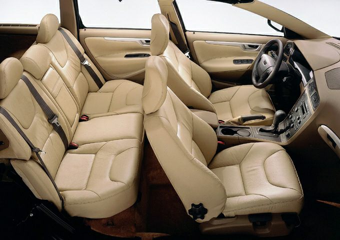 Beige leather interior with spacious seating and detailed dashboard
