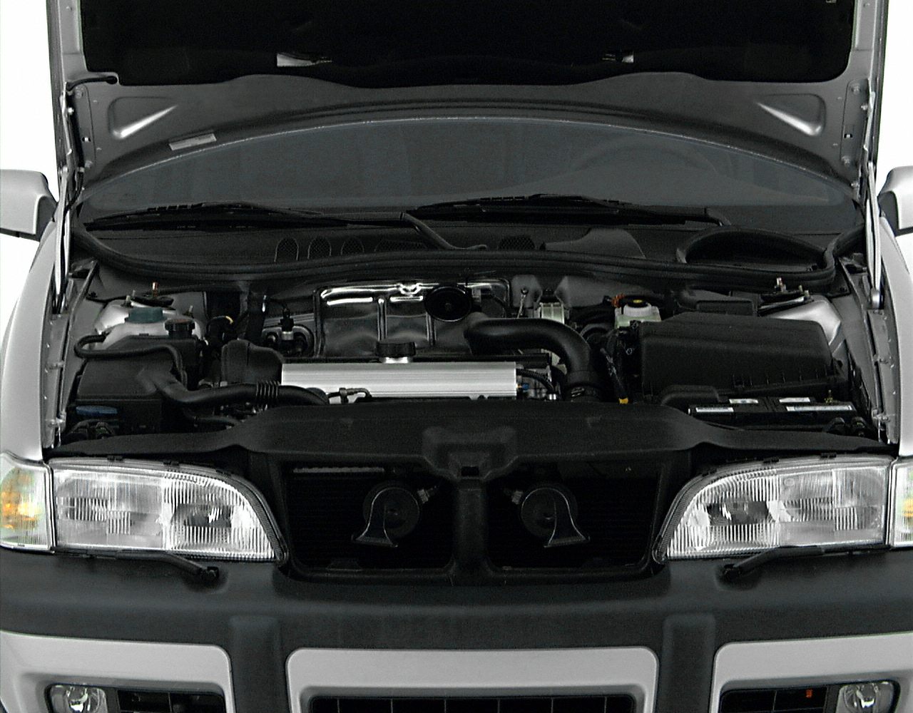 Front engine bay with detailed engine components and dual front headlights