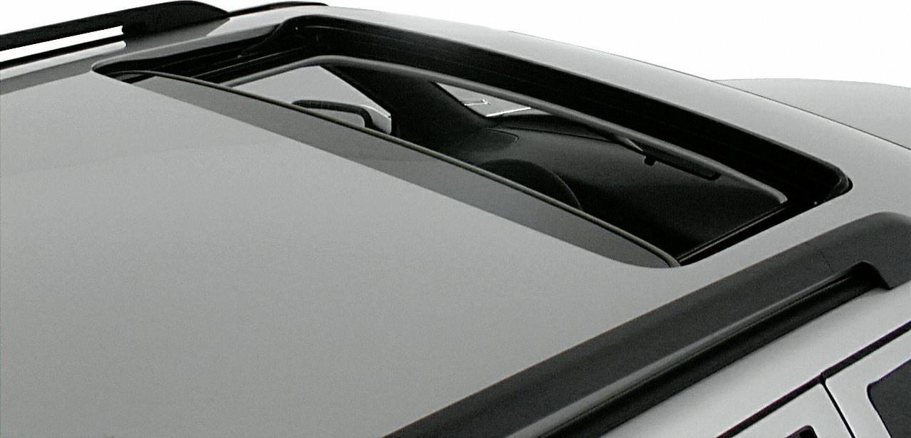 Close-up view of an open sunroof on a station wagon roof