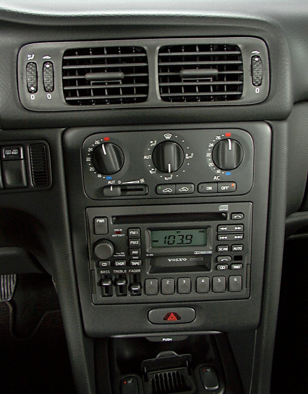 Classic car dashboard with cassette radio and manual AC controls