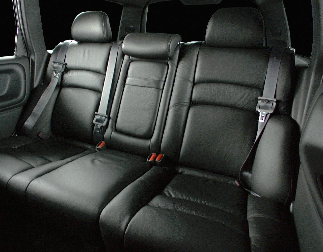 Black leather rear seats with headrests and seatbelts