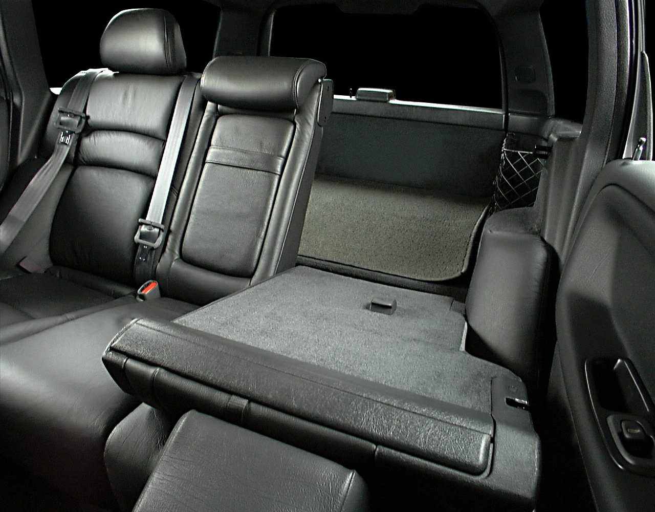Rear seats with fold-down feature and black leather upholstery