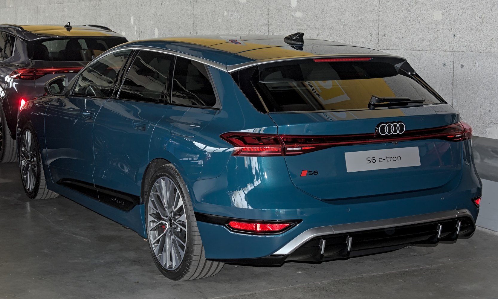 Rear and side view of modern luxury electric wagon with sleek design and tail light strip