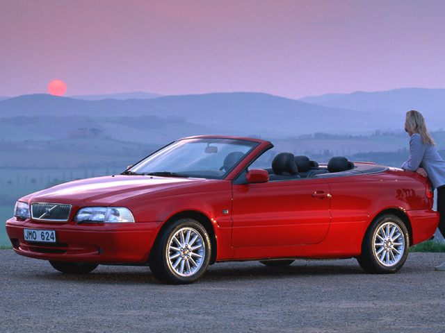 Red convertible with soft-top roof and alloy wheels