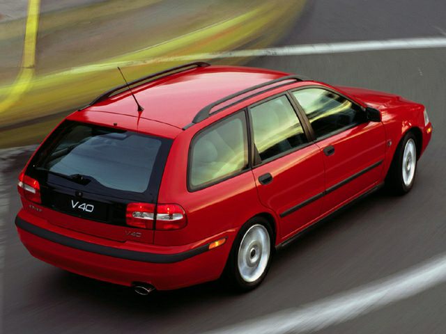 Red station wagon with roof rails and rear design.