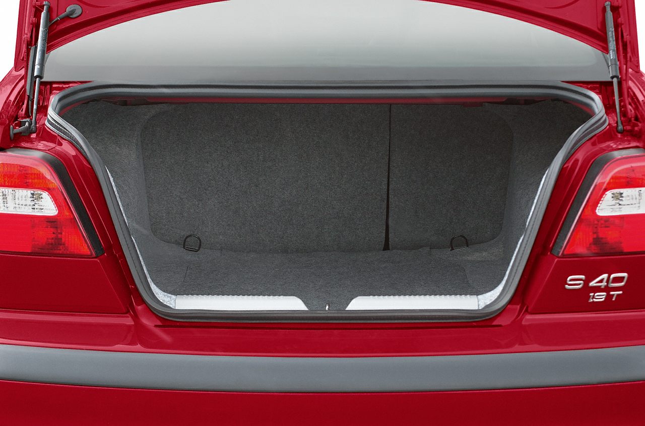 Open rear trunk with spacious, carpet-lined storage interior