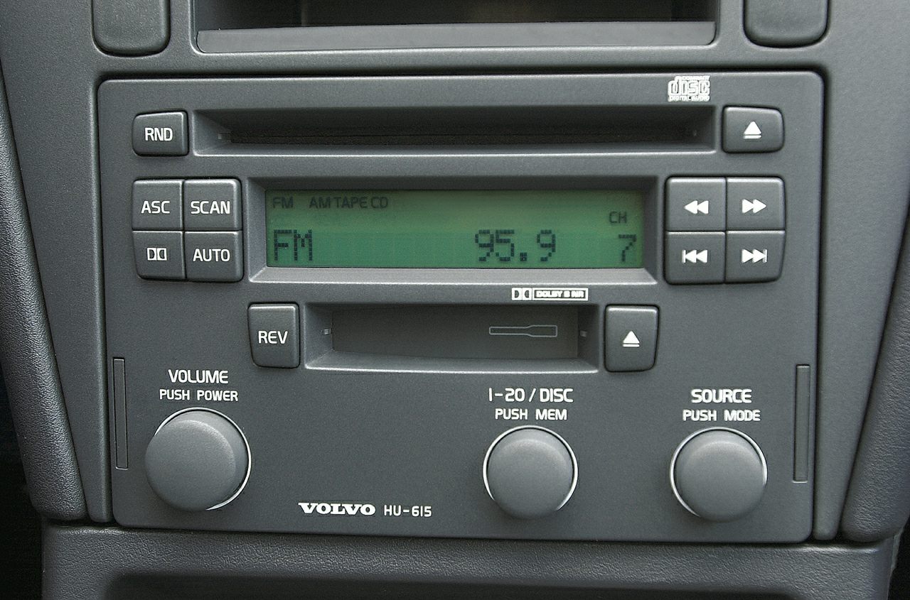 Vintage car radio with tape, CD player, digital FM display and control knobs