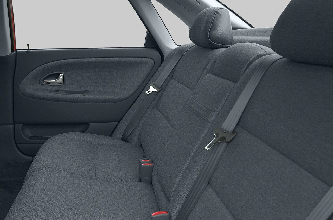 Rear fabric upholstery, seat belts, and side door panel in car interior