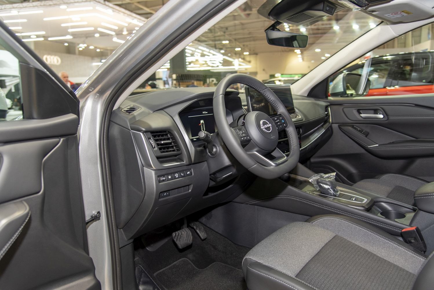 Dashboard and steering wheel with modern controls and premium upholstery
