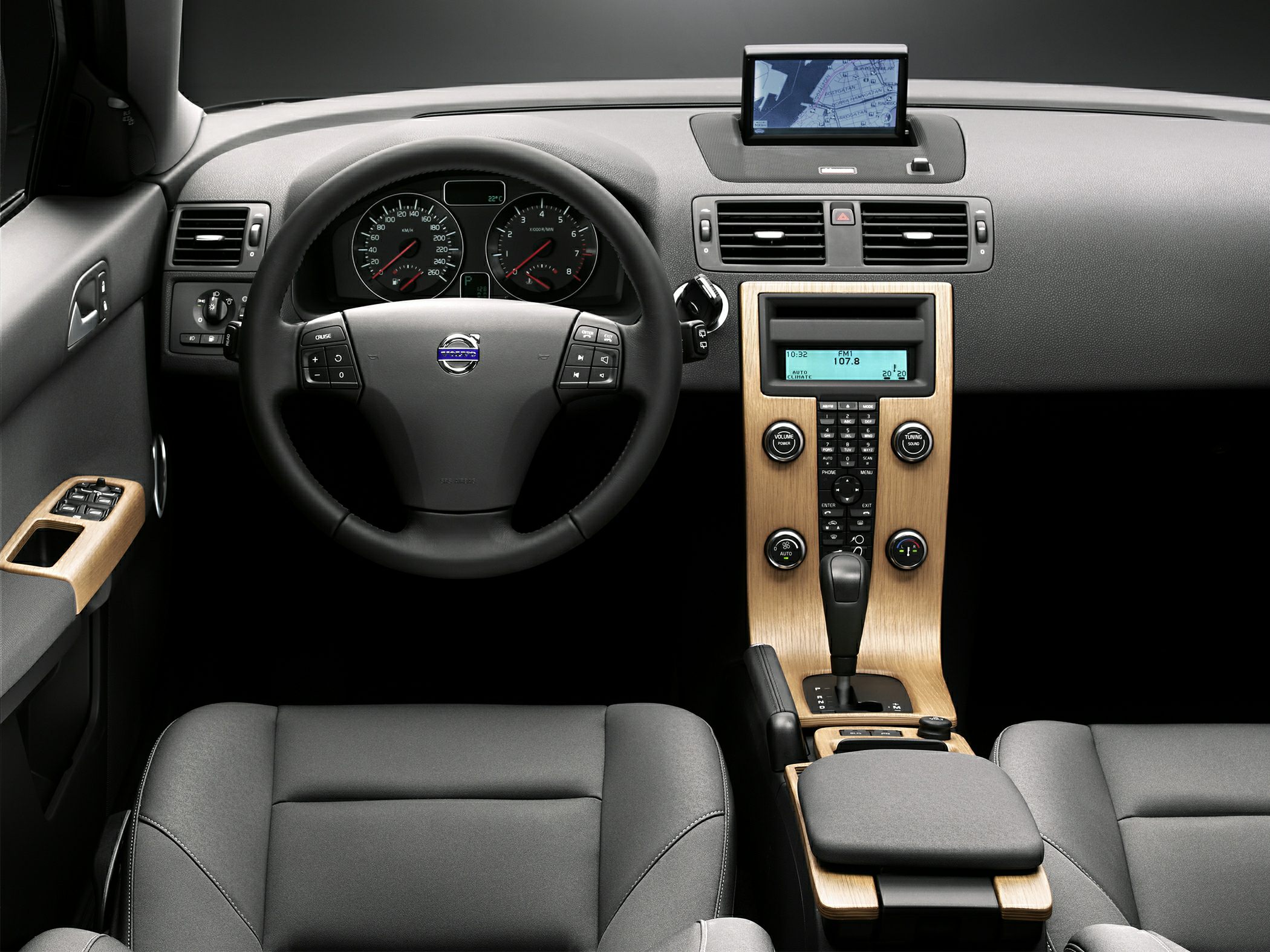 Dashboard and center console with navigation screen and wood trim