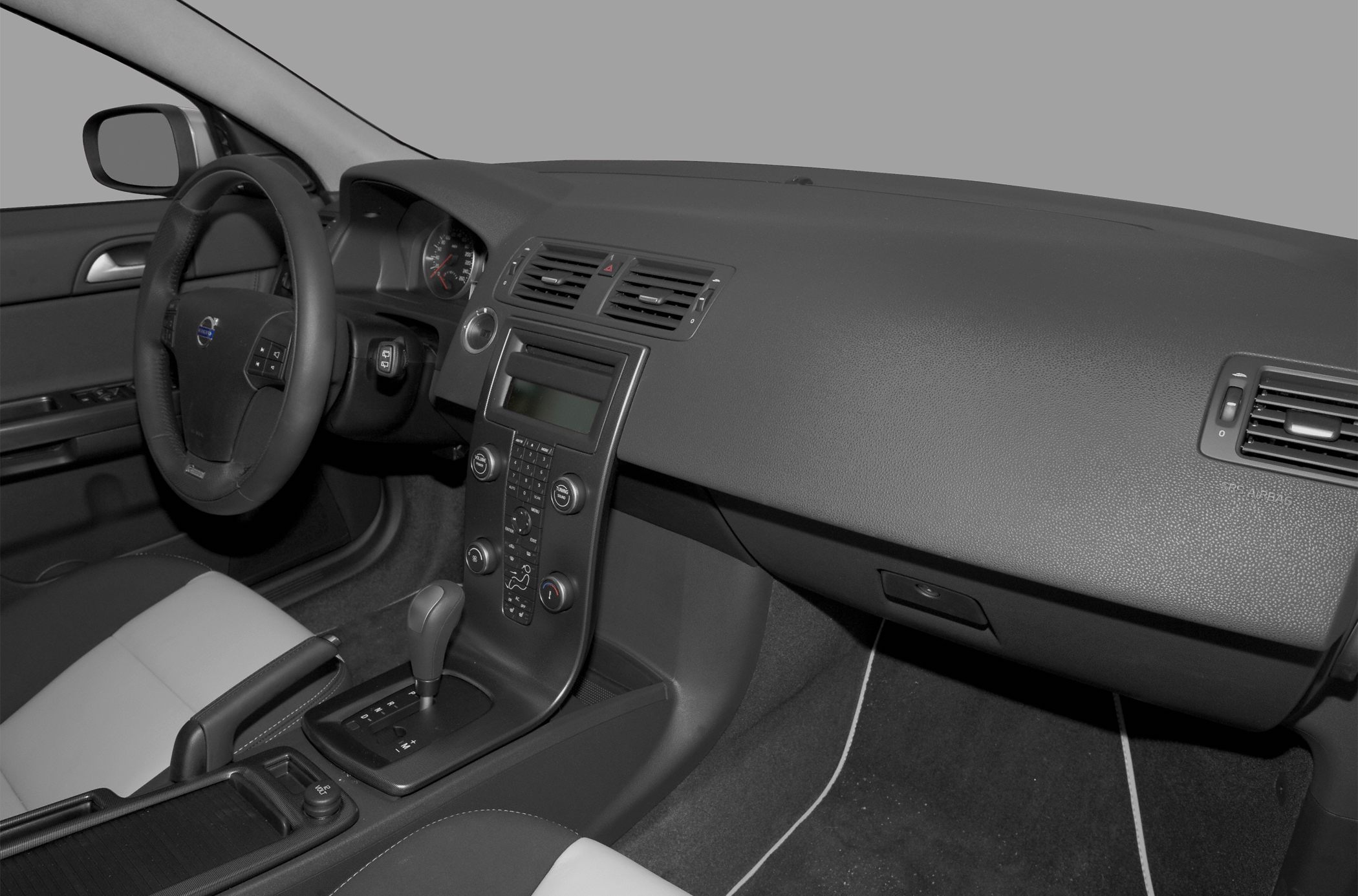 Dashboard and center console with steering wheel and gear shift