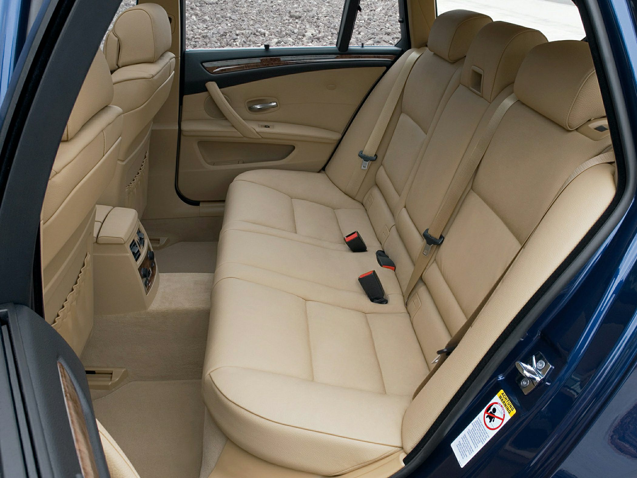 Beige leather rear seats, spacious and comfortable seating interior