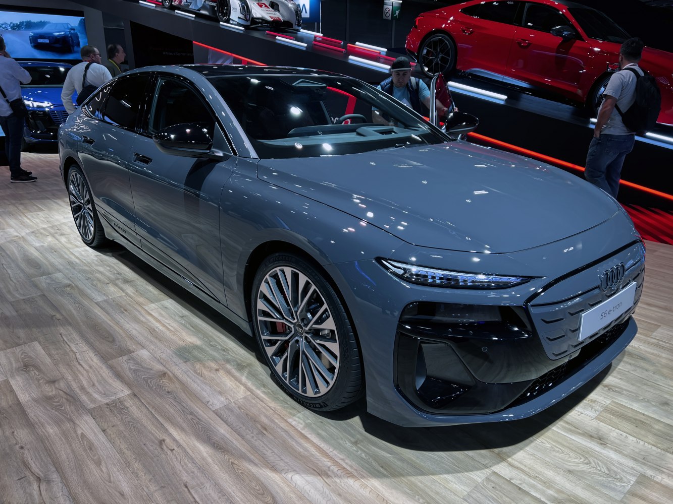 Front and side view of modern electric luxury sedan with LED headlights