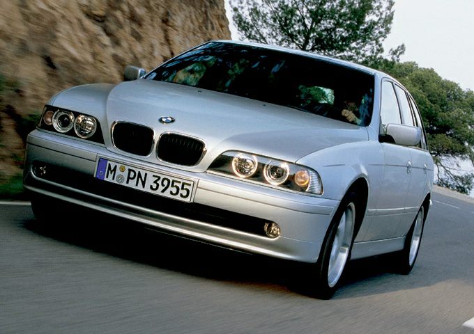 Silver BMW Touring with kidney grille and round headlights in motion