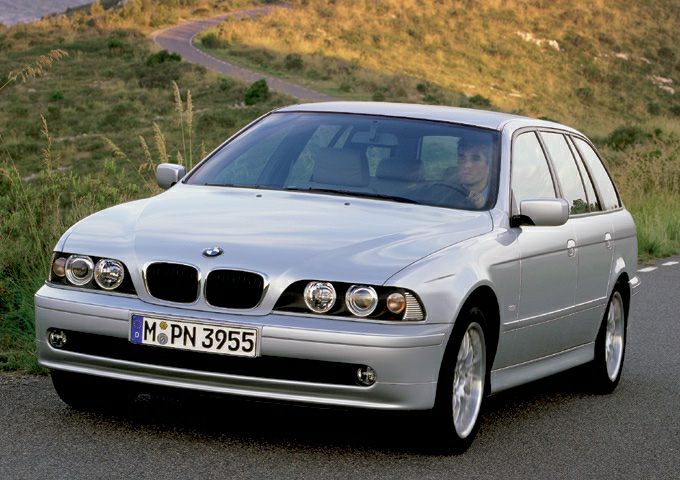 Silver wagon with quad headlights and sleek design