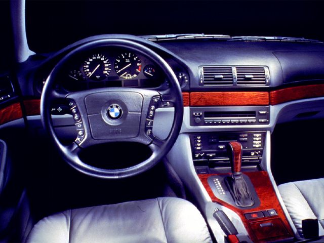 Interior dashboard, steering wheel, wood trim, automatic gear shift