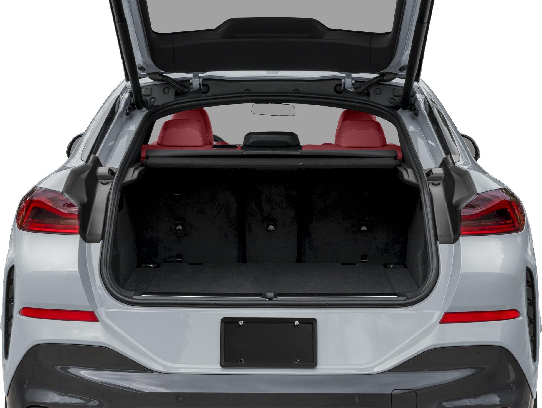 Open rear trunk space with red seats visible