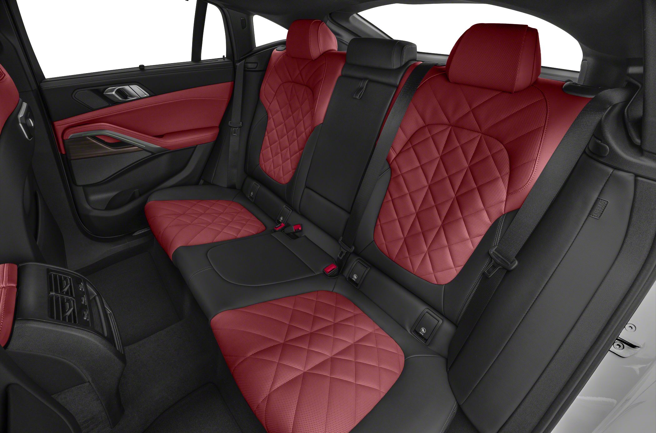 Red and black quilted leather rear seats with modern door panel and climate controls