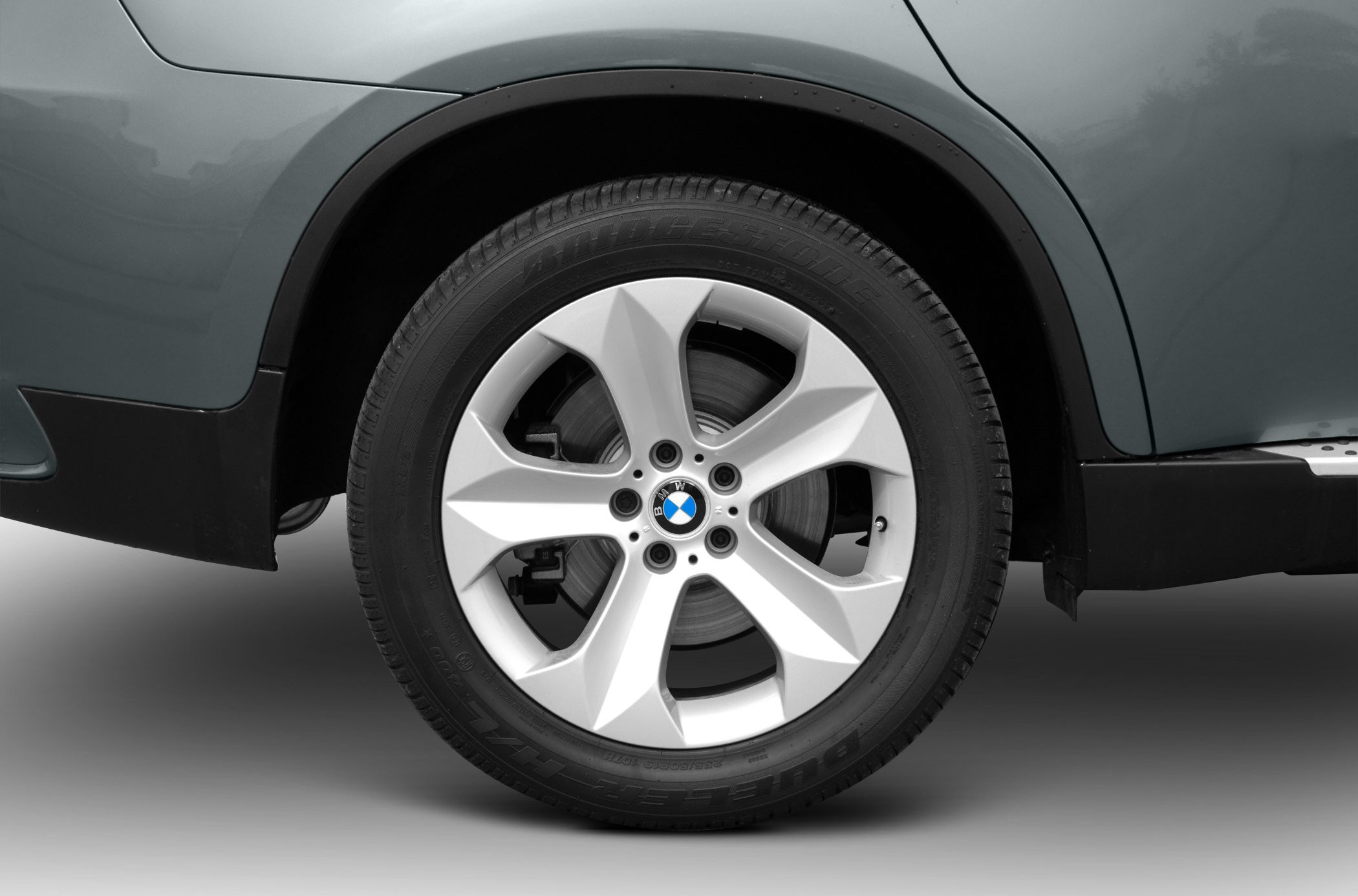 Close-up of alloy wheel and tire with brake components