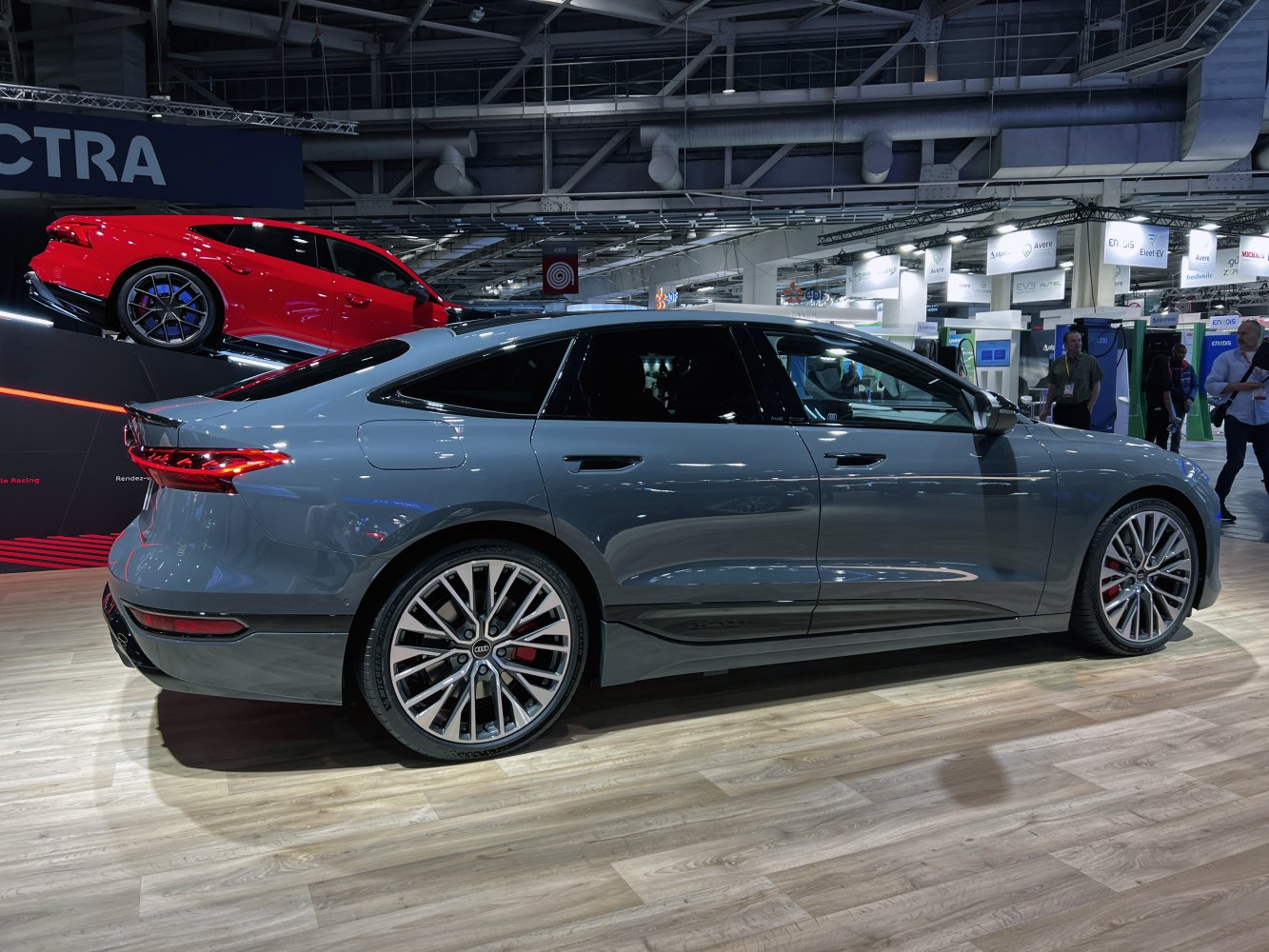 Side profile of sleek electric sportback with aerodynamic design and sporty wheels