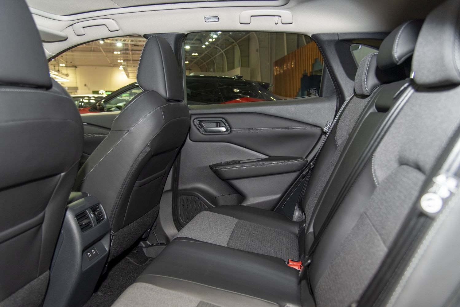 Spacious rear seating with mixed fabric and leather upholstery, door panel, and rear air vents
