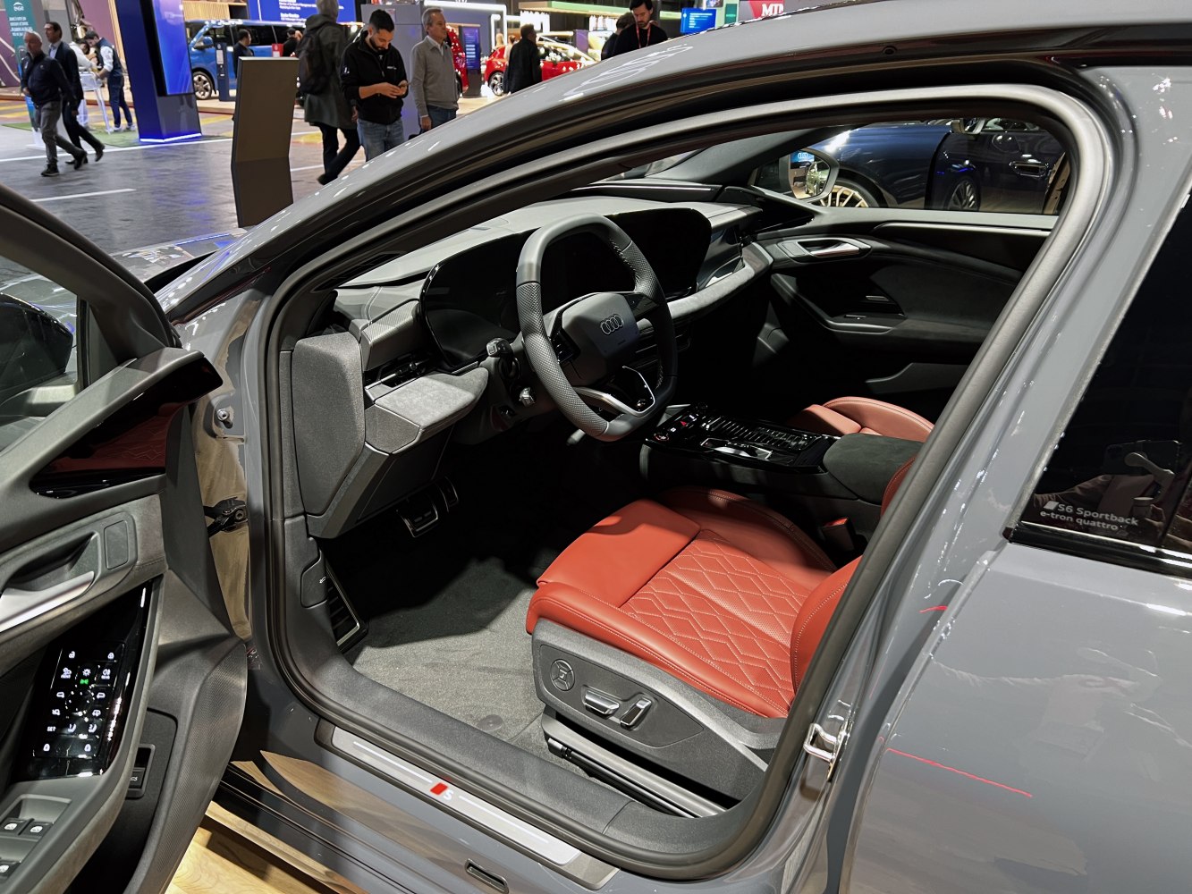 Red diamond-stitched leather seat and modern digital cockpit