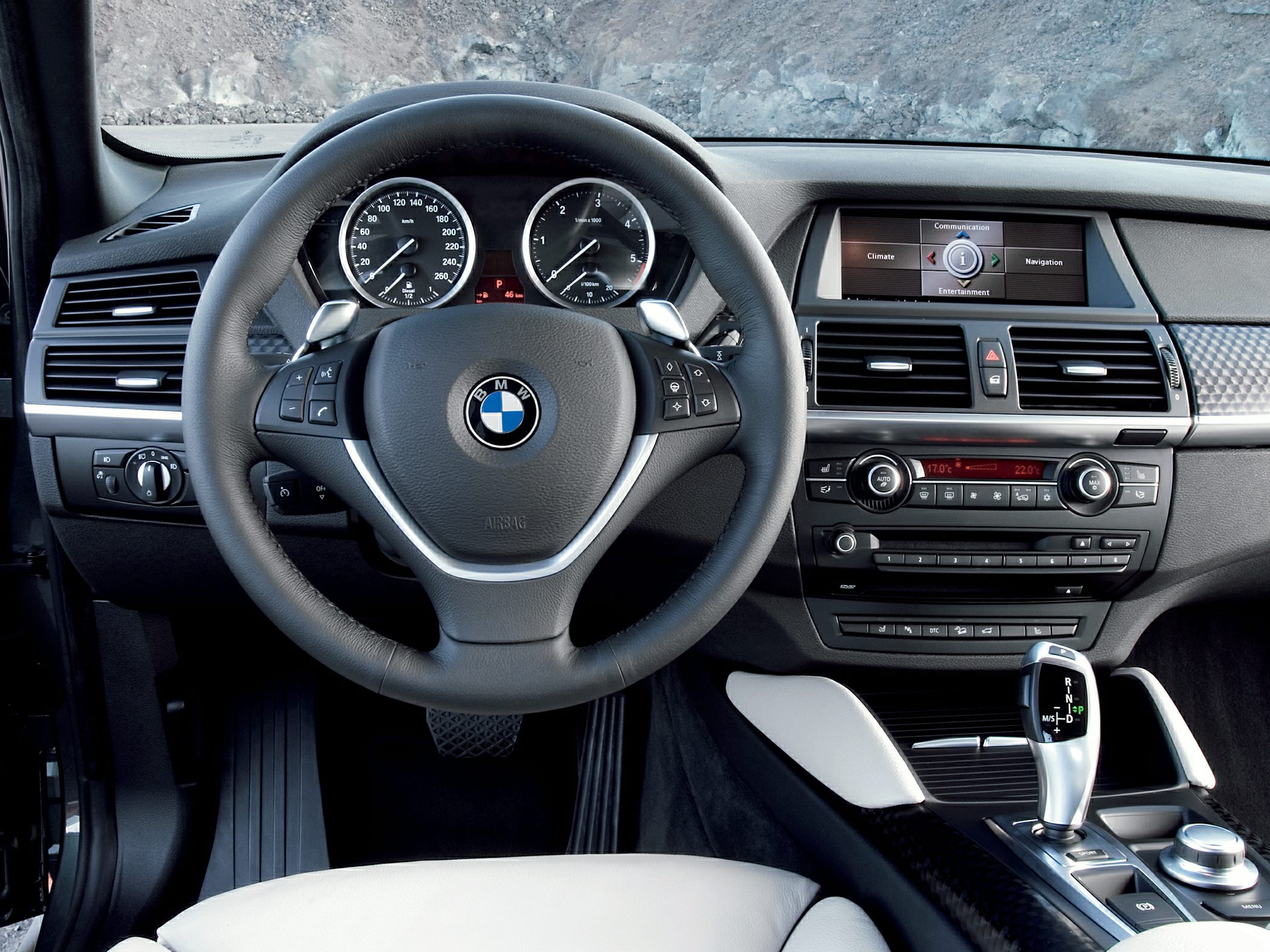 Dashboard and steering wheel with infotainment and gear shift