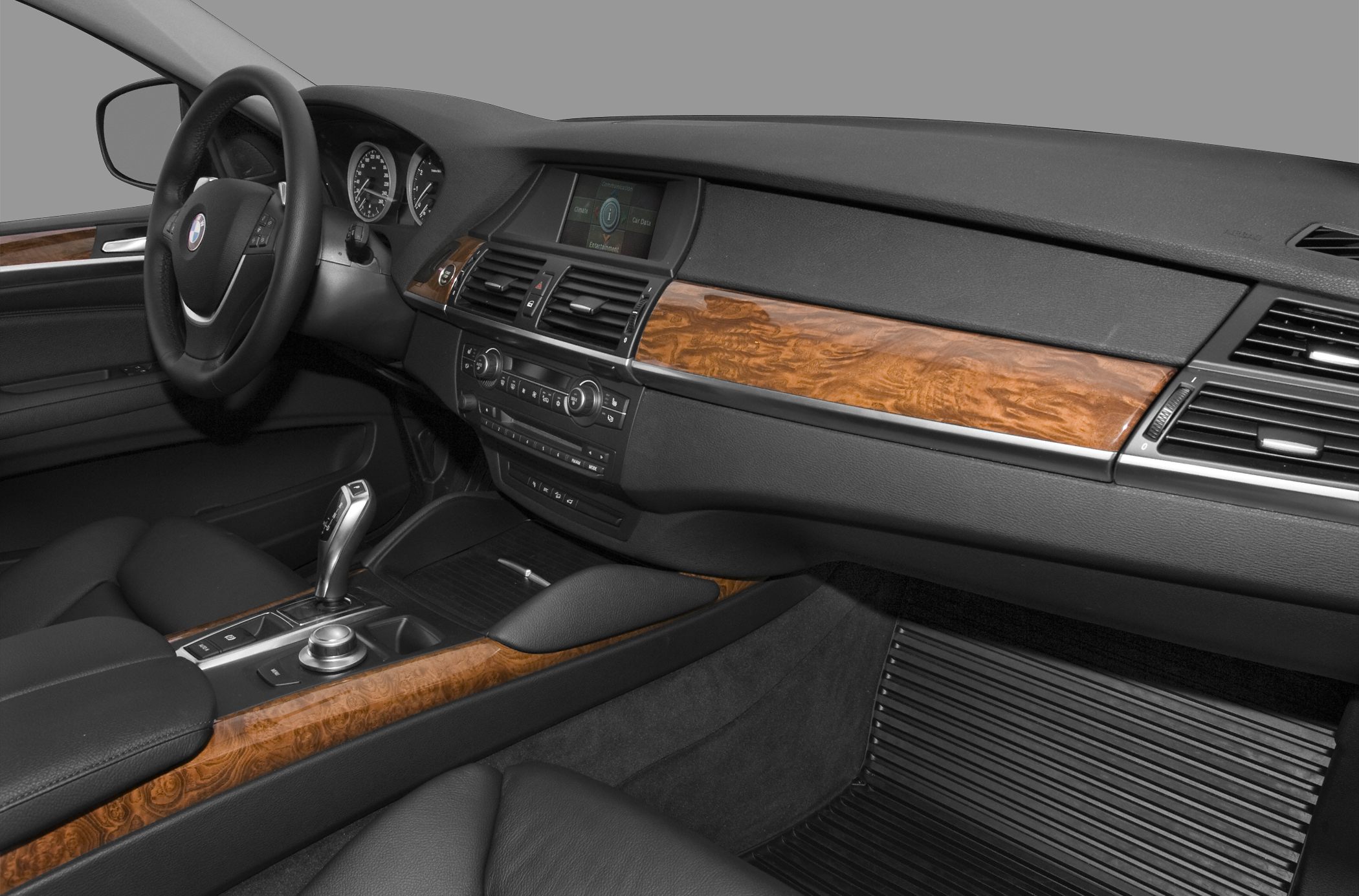 Luxury car interior with wood trim and dashboard controls