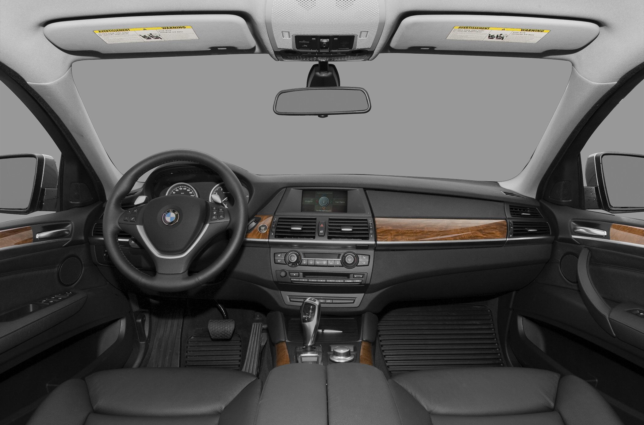 Luxury dashboard with wood trim and ergonomic steering wheel
