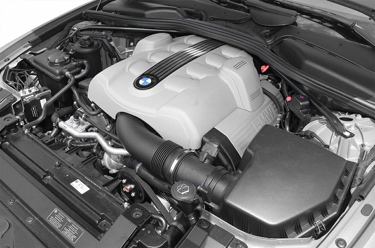 Detailed V8 engine bay with engine cover and components