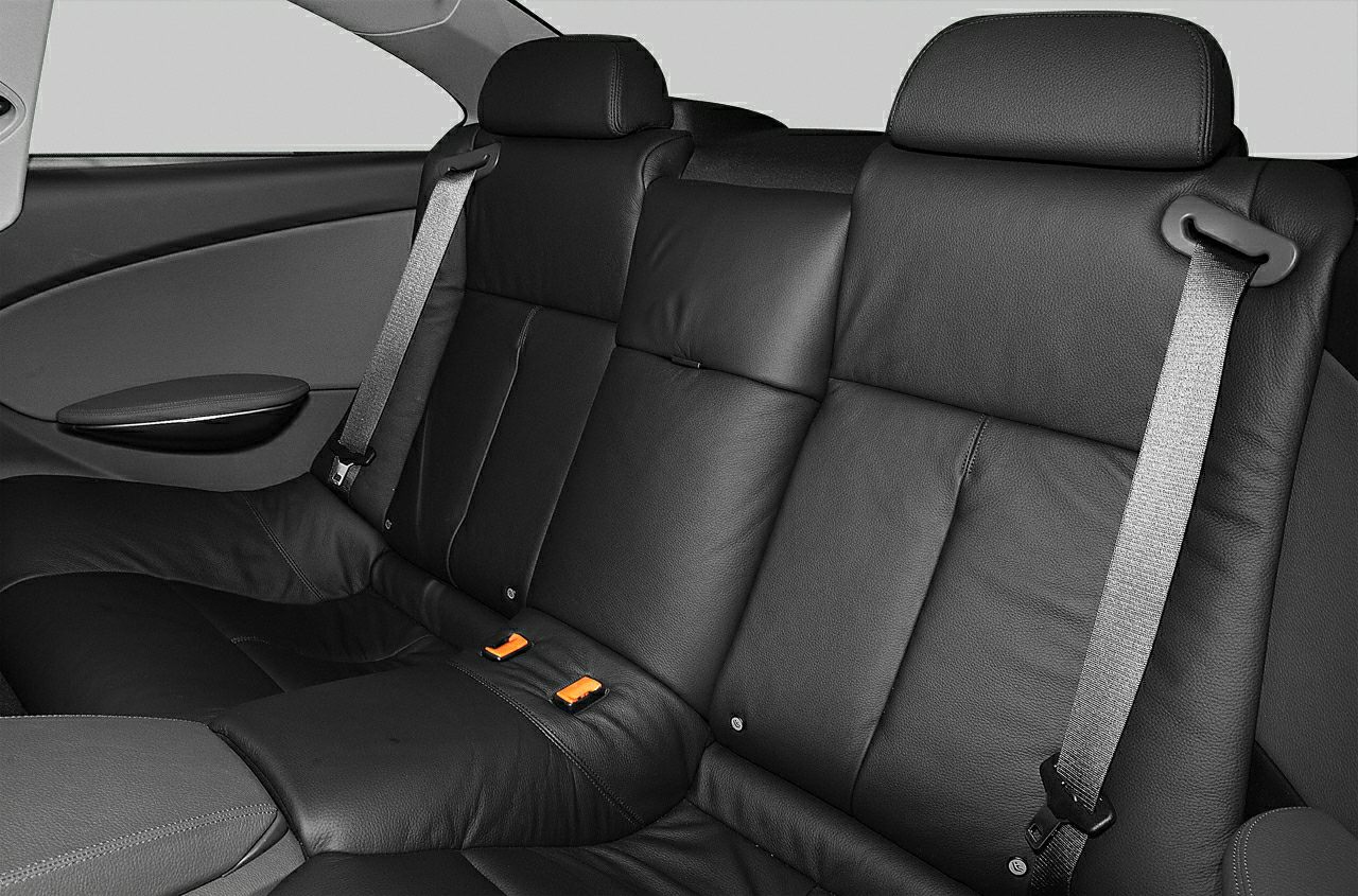 Black leather rear seats with seat belts in car interior