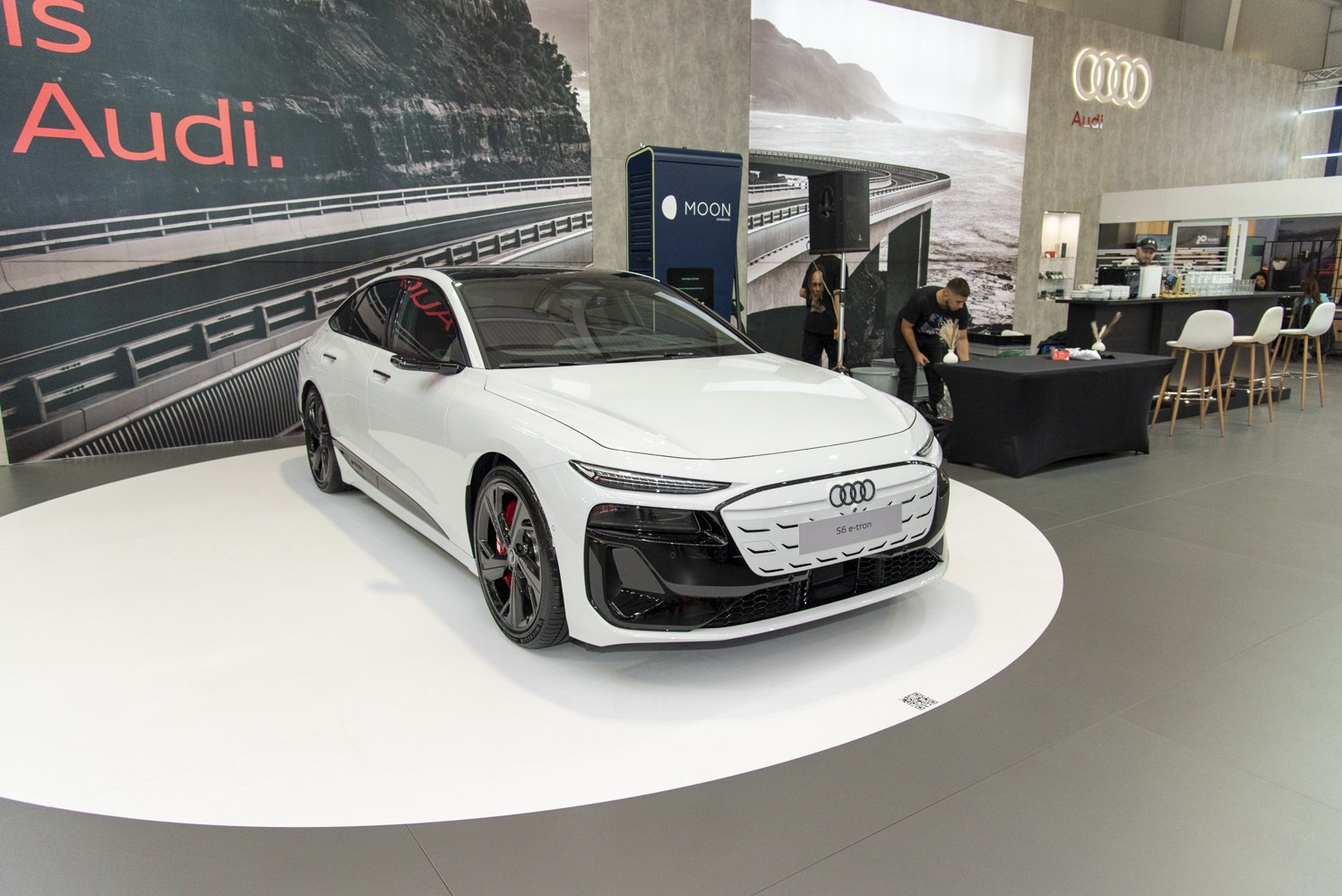 Modern electric sedan with sleek front grille and LED headlights