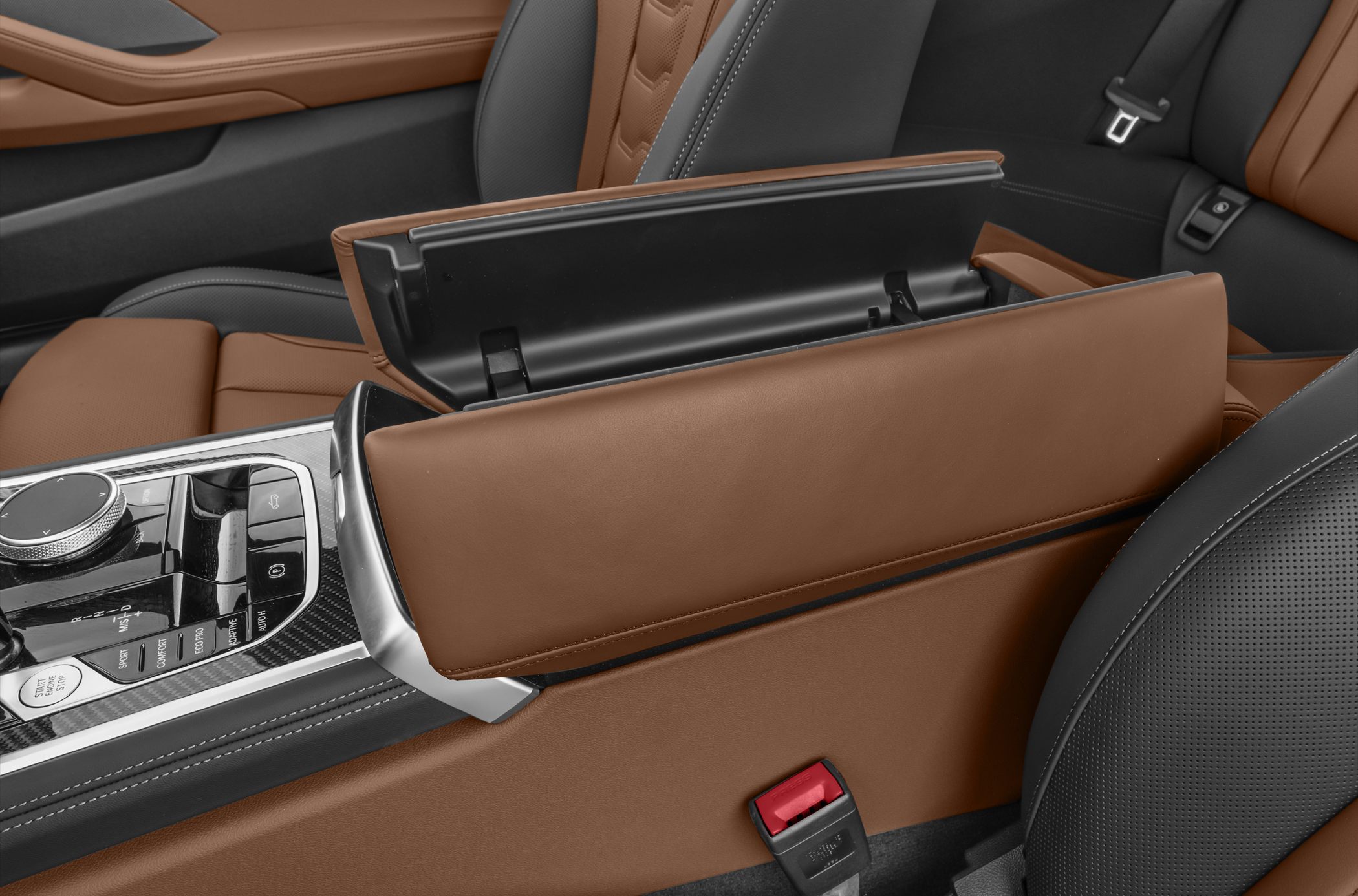 Open armrest storage and leather interior detail