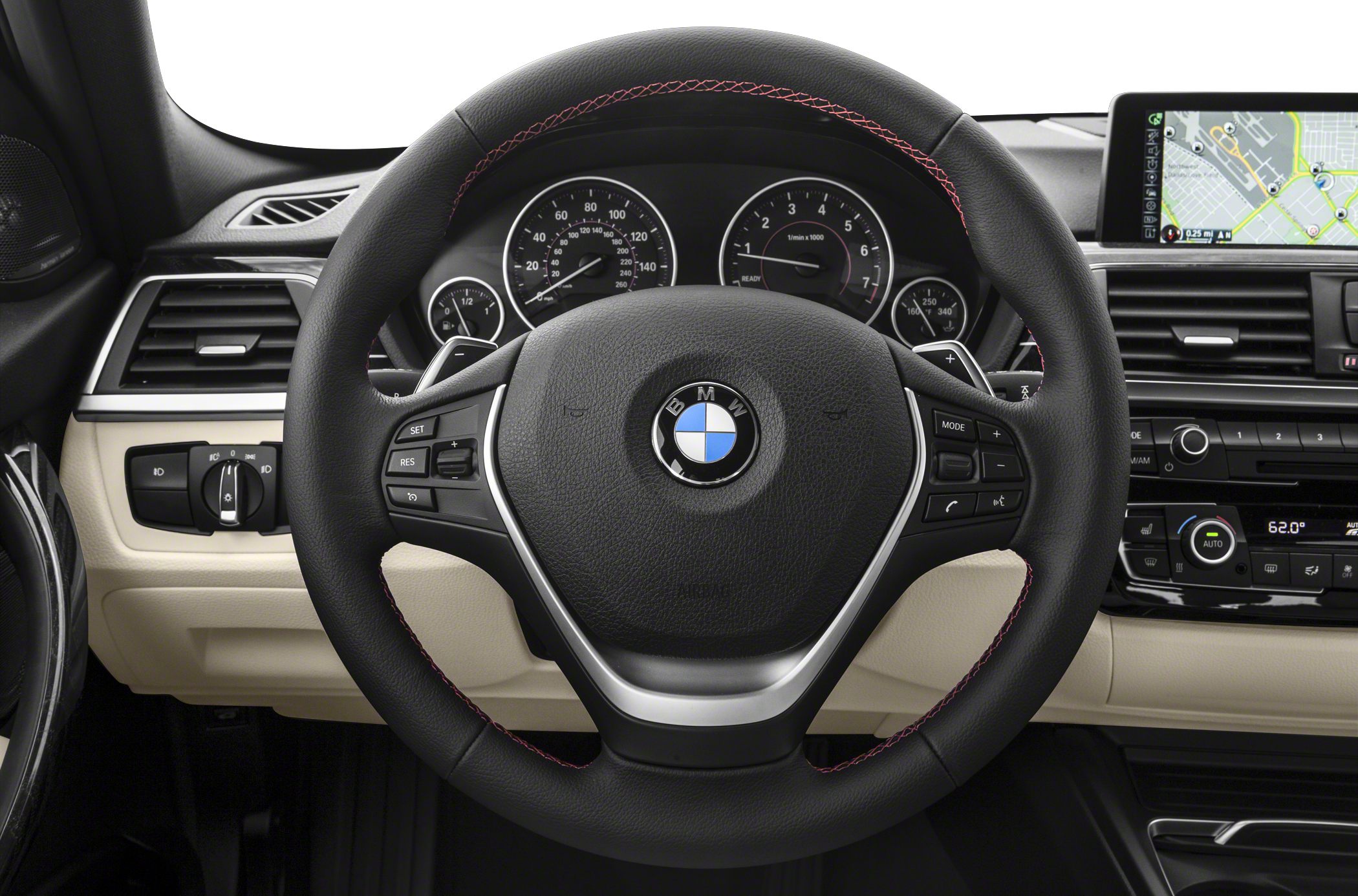 Steering wheel with controls and dashboard cluster with navigation screen