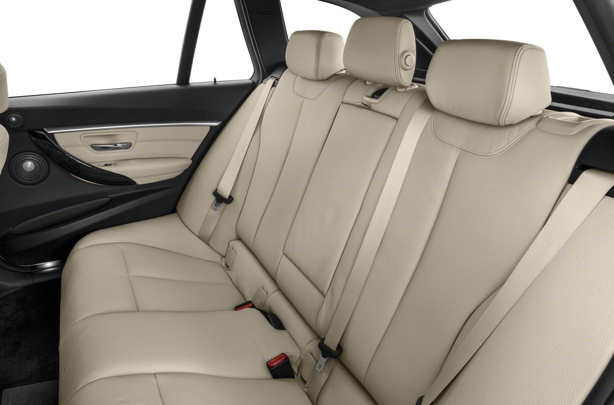 Beige leather rear seating with headrests and seatbelts