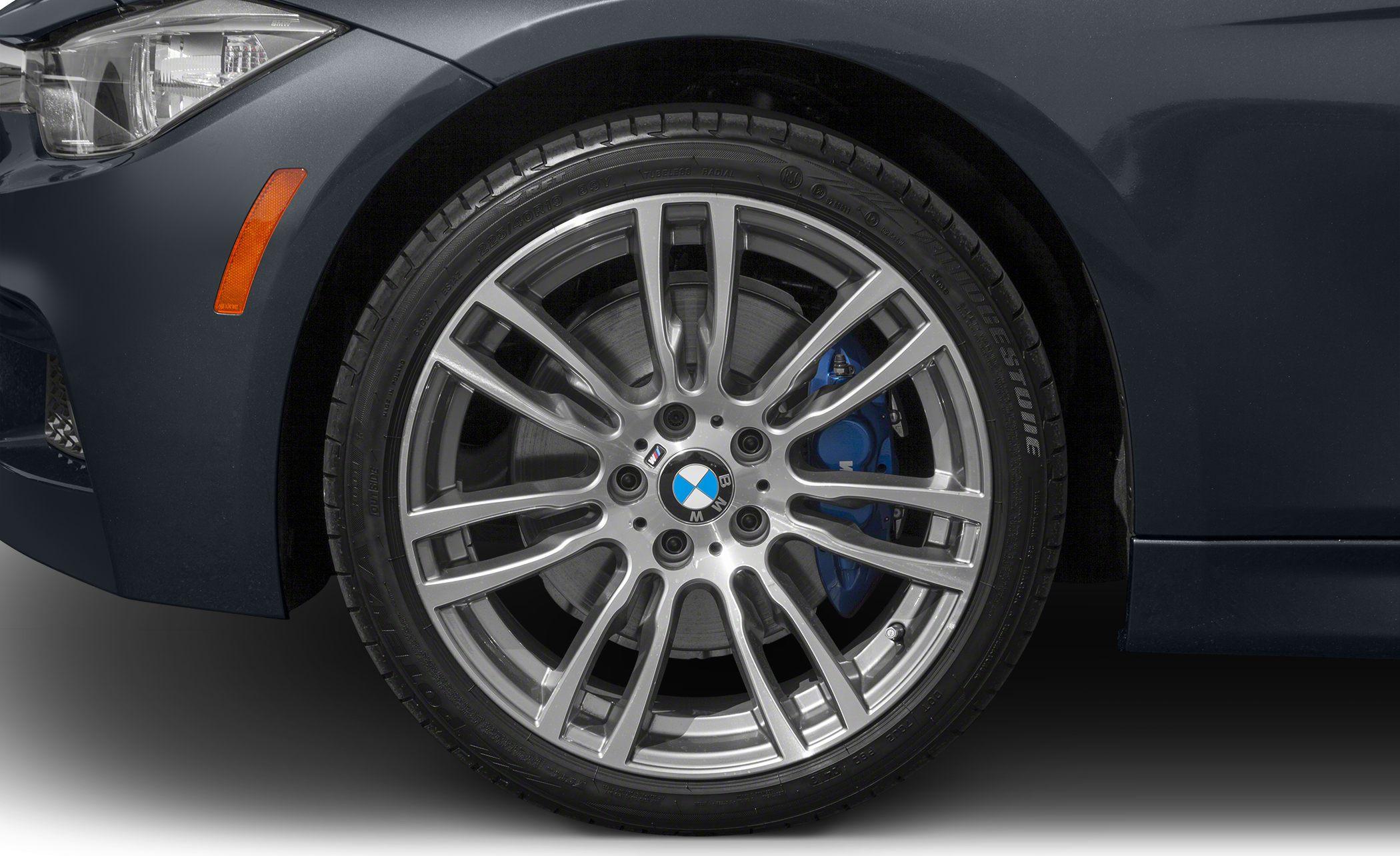 Alloy wheel with multi-spoke design and blue brake caliper