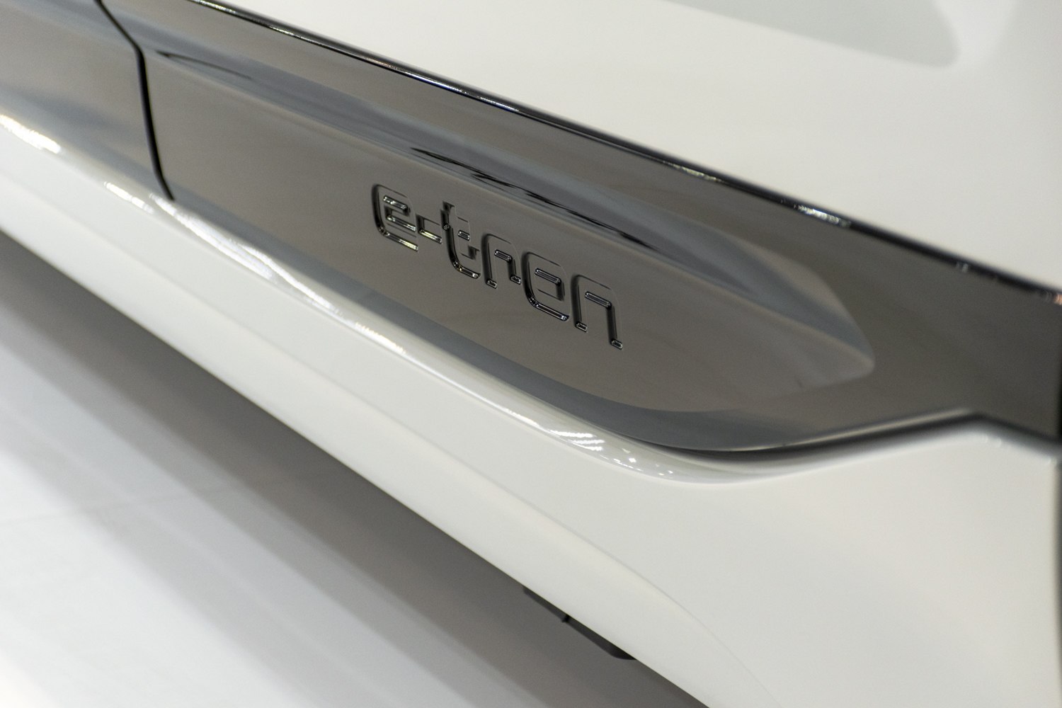 Close-up of e-tron emblem on vehicle side panel