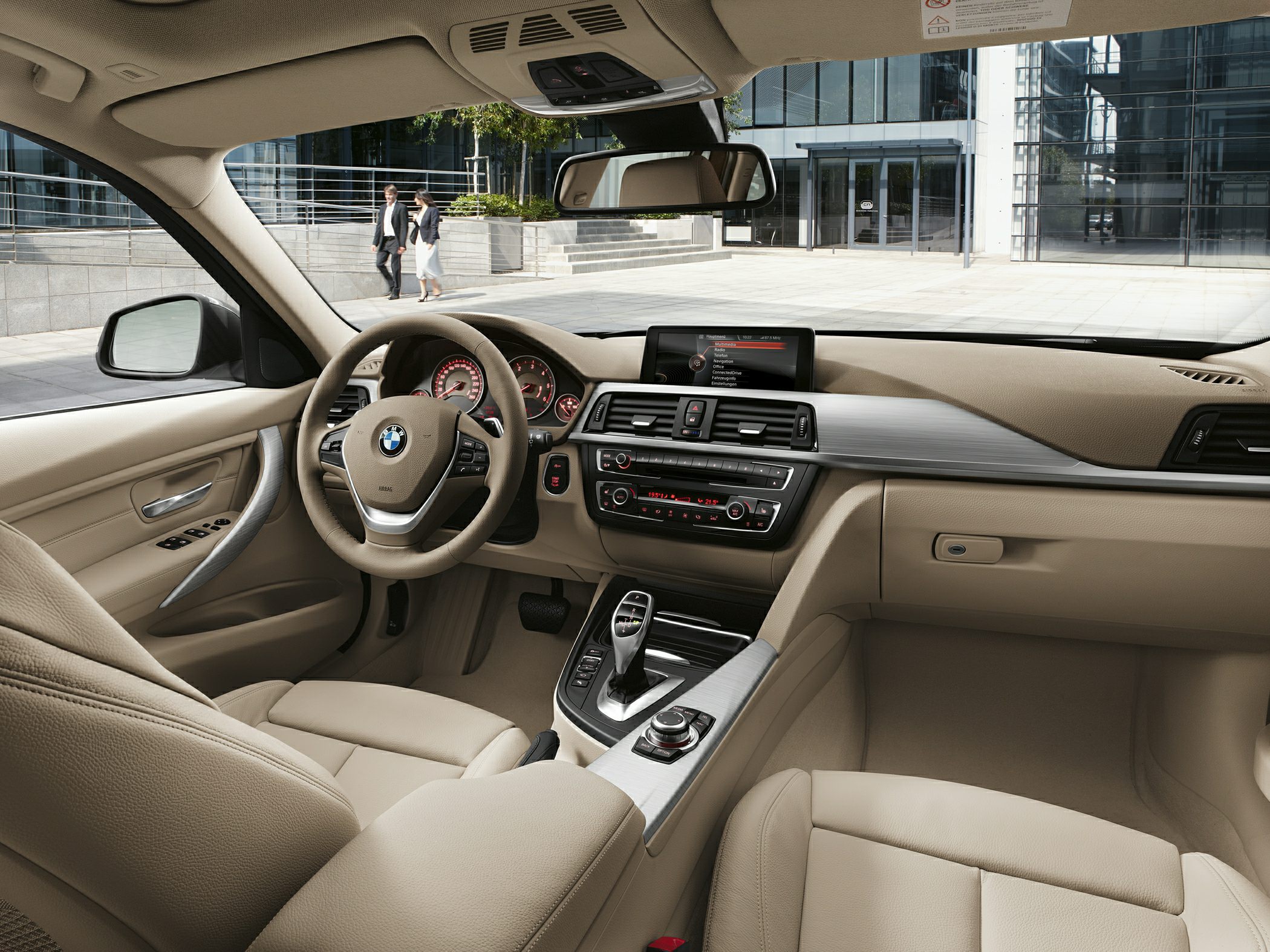 Beige leather interior with modern dashboard and digital display