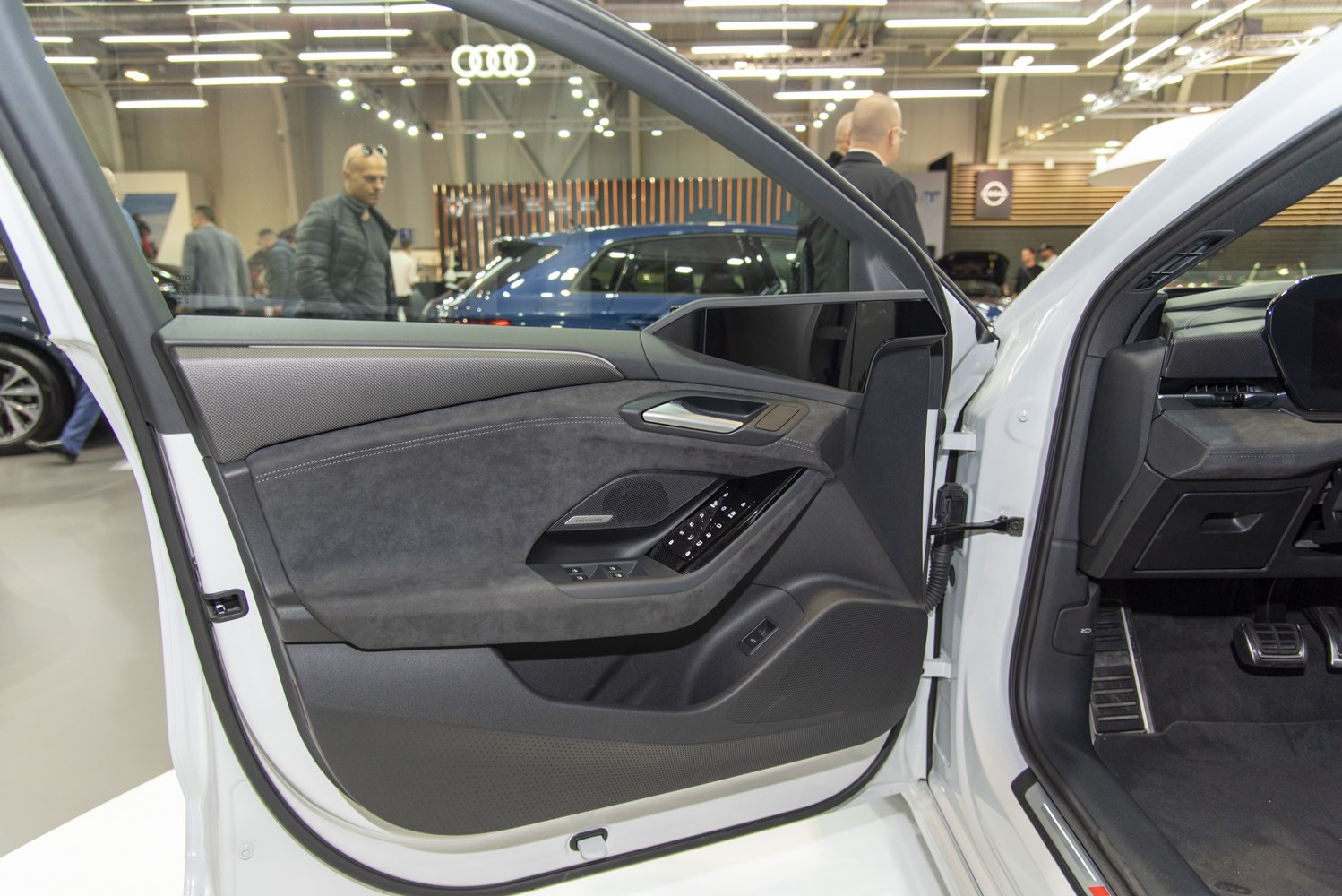 Interior door panel with digital side mirrors and premium materials
