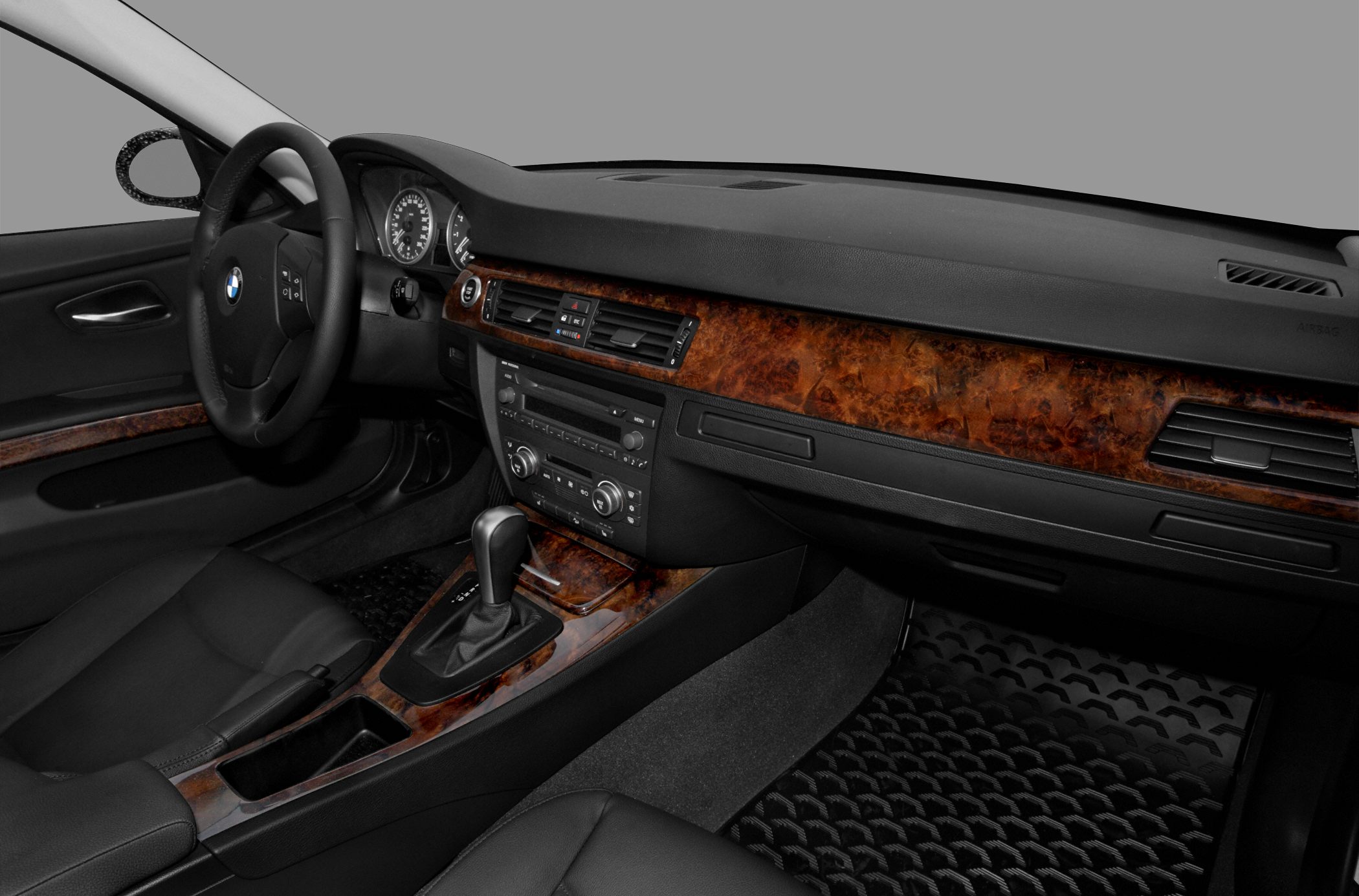 Wood-trimmed dashboard with automatic gear shifter and steering wheel