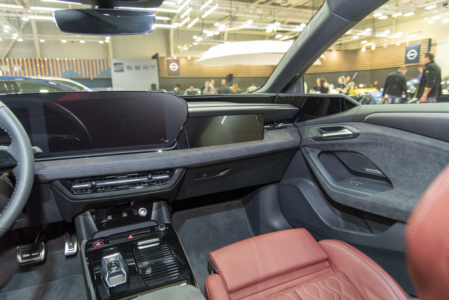 Modern car interior with digital dashboard and premium brown leather seat