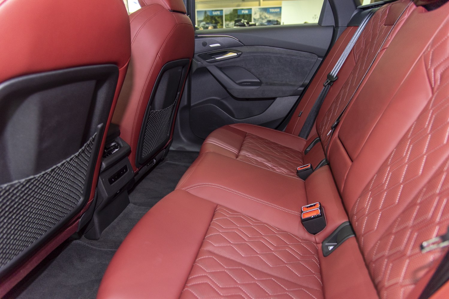 Red leather quilted rear seats with spacious legroom and seatbelts