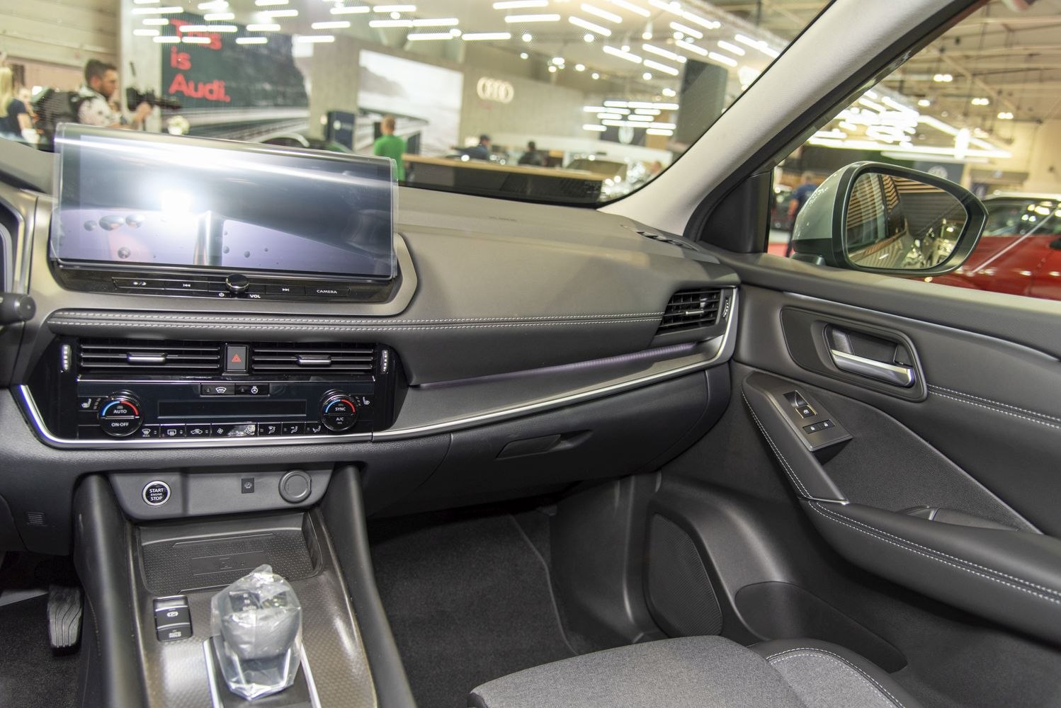 Modern car interior dashboard and center console with touchscreen and gear shifter