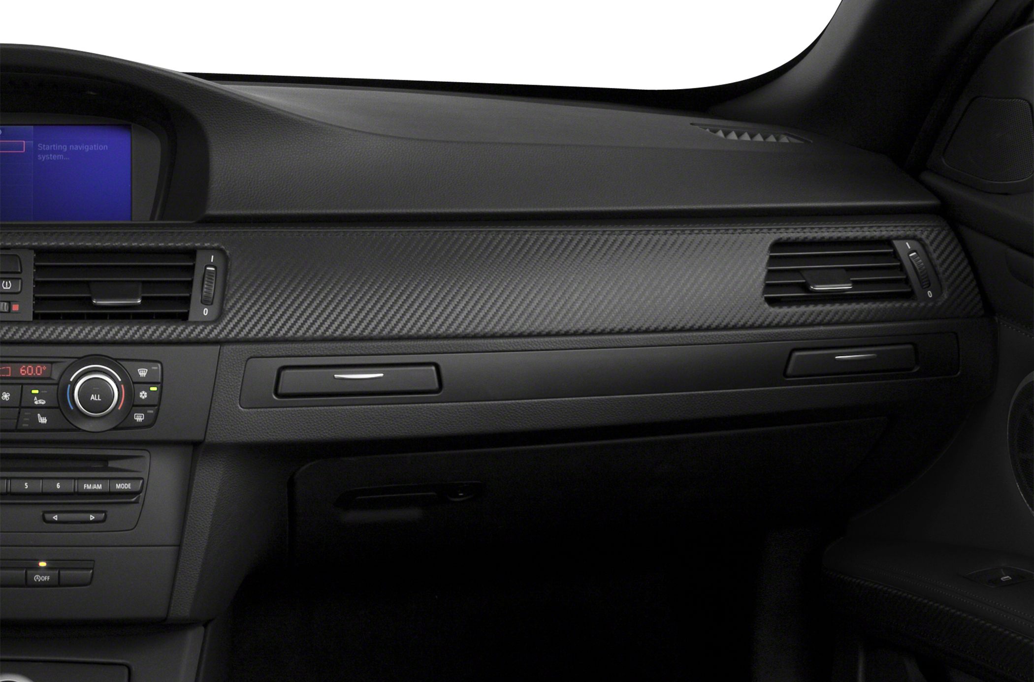 Dashboard with carbon fiber trim and climate control panel.