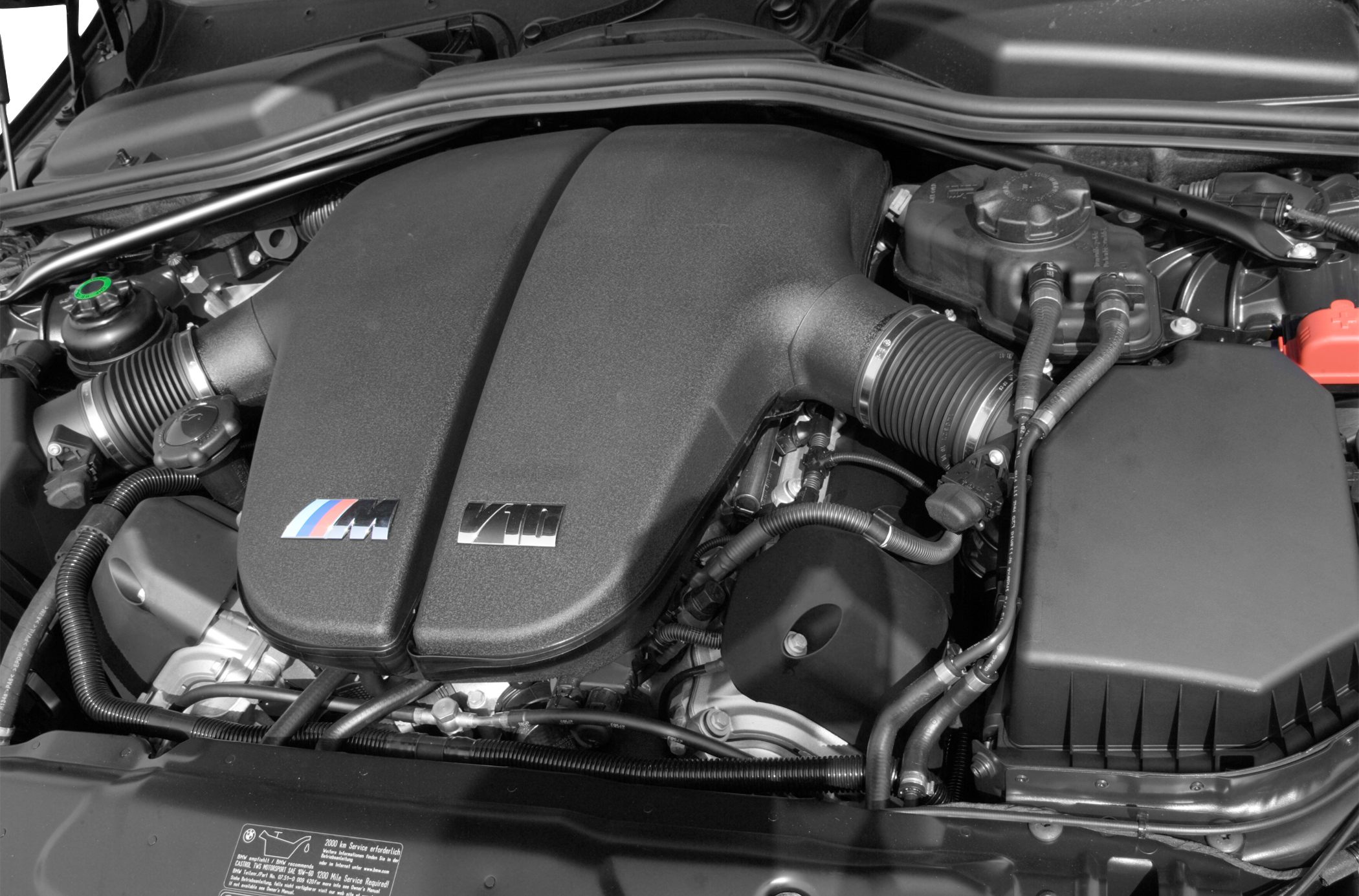 Close-up of BMW M5 E60 V10 engine bay with intake and components