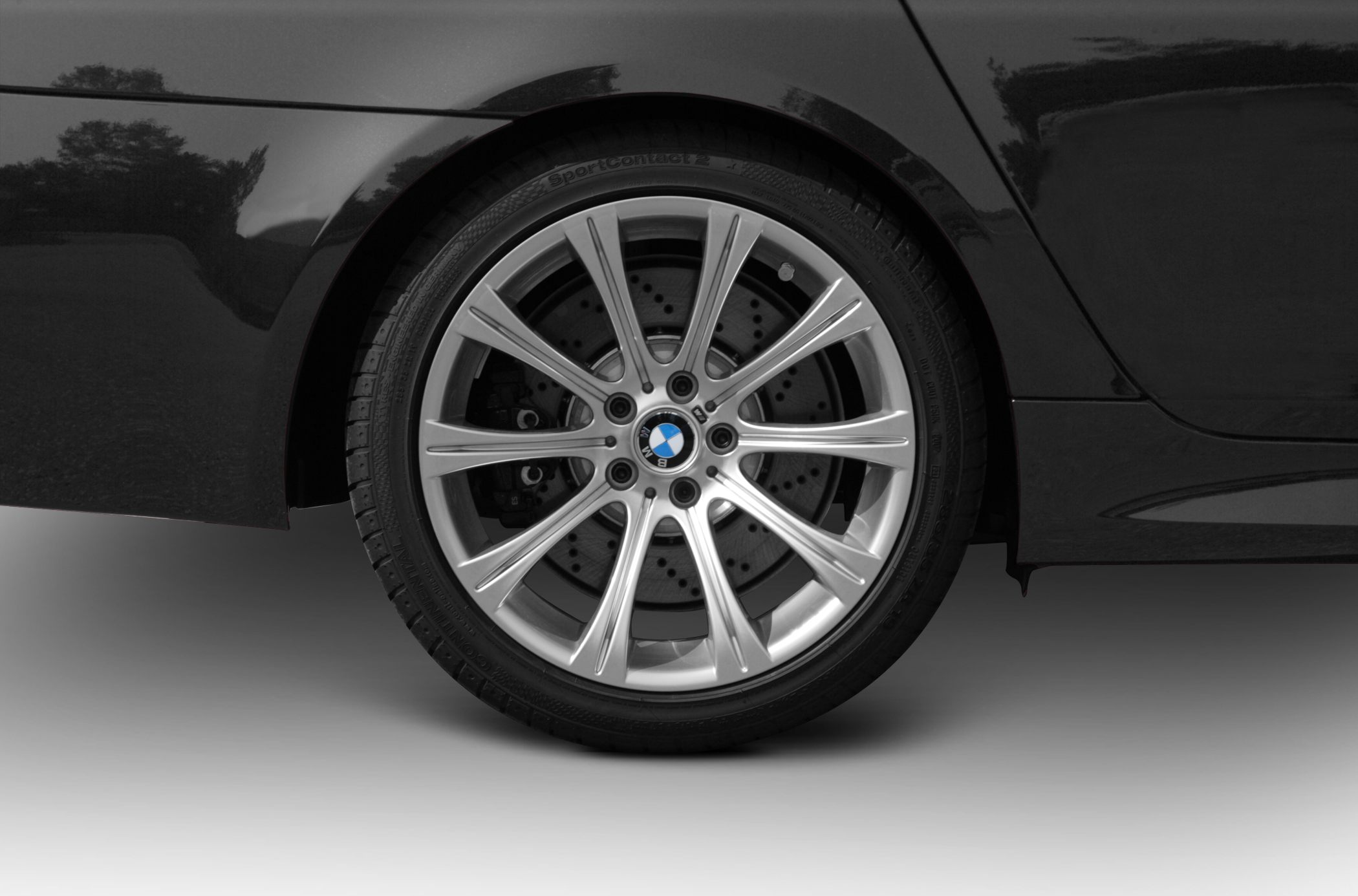 Rear multi-spoke alloy wheel with drilled brake disc