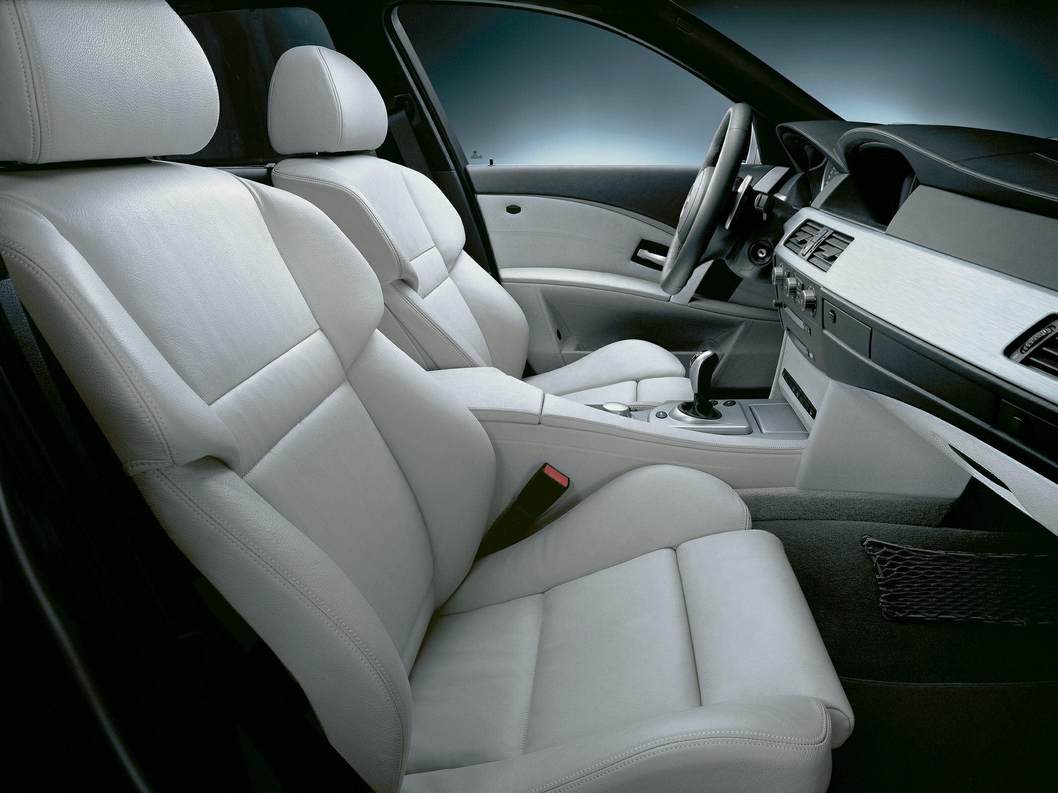 Light gray leather seats and stylish dashboard in a modern car interior