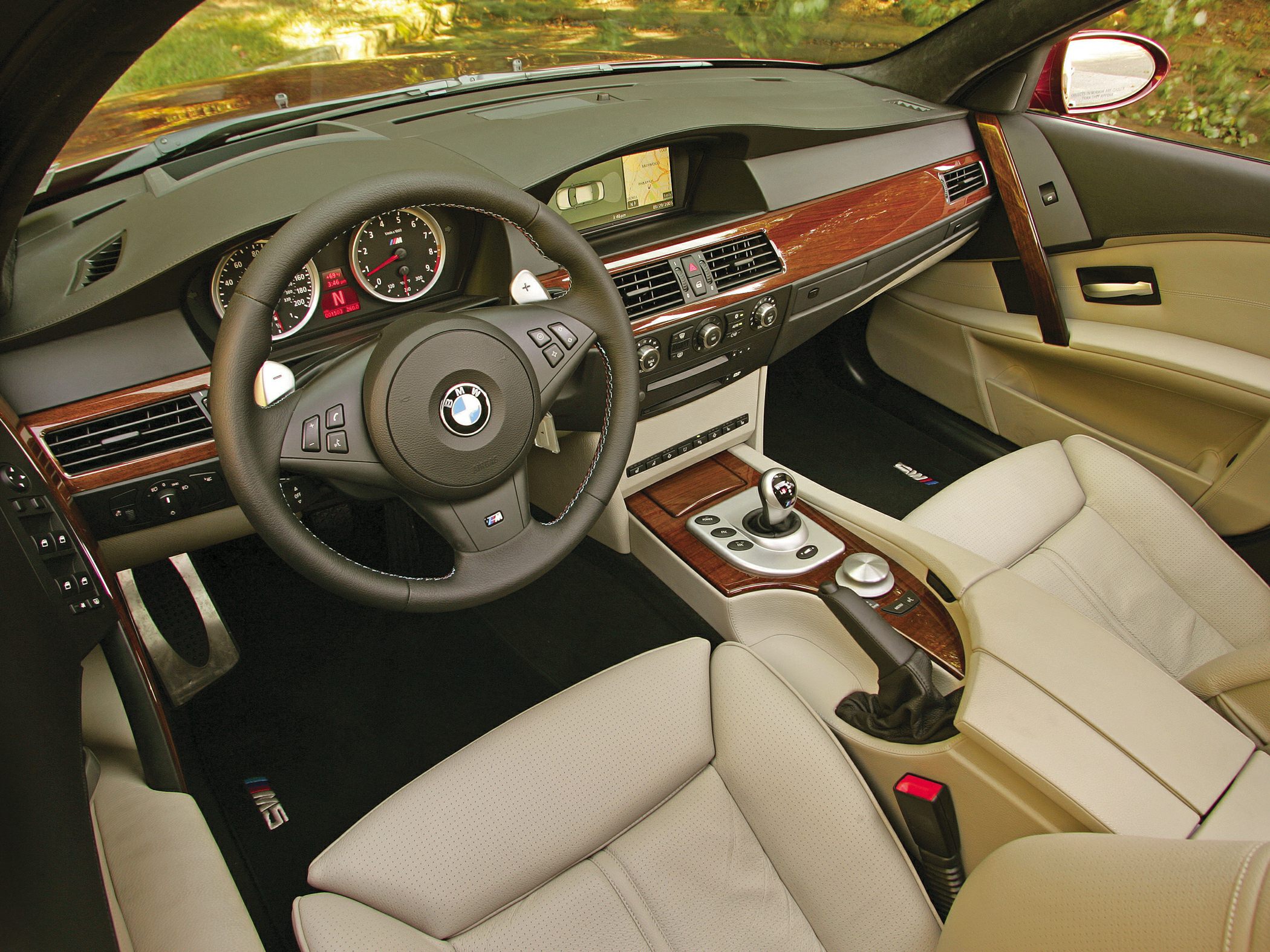 Dashboard, steering wheel, and center console with wood trim